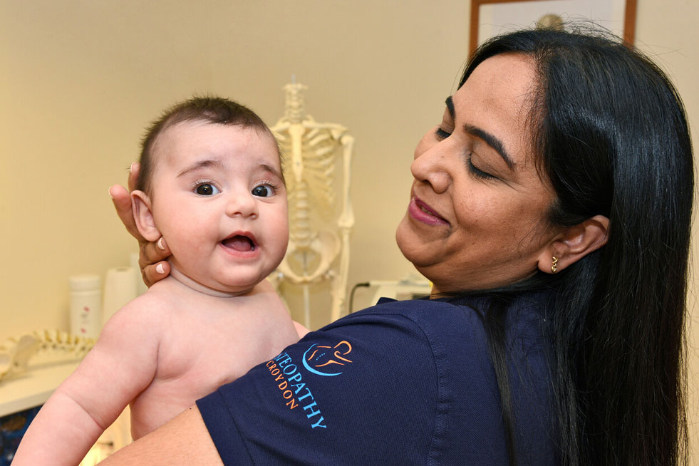 woman holding a baby